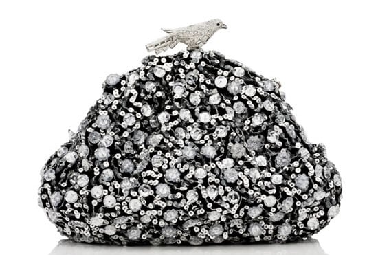 Judith Leiber Black Stardust bag is secured with a crystal bird