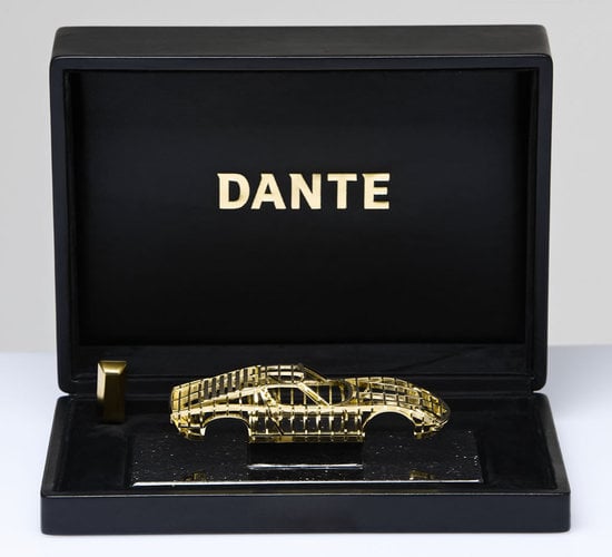 Dantes exclusive solid gold sports car miniature is worth over $100,000 Dantes exclusive solid gold sports car miniature is worth over $100,000