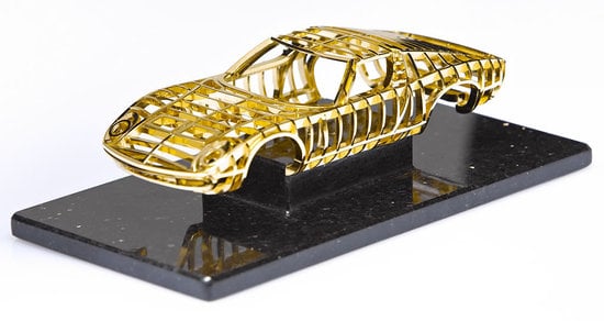 Dantes exclusive solid gold sports car miniature is worth over $100,000 Dantes exclusive solid gold sports car miniature is worth over $100,000