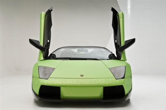 This Lamborghini Murcielago Roadster is customized with an automated cigar holder This Lamborghini Murcielago Roadster is customized with an automated cigar holder
