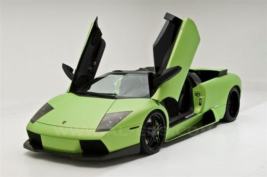 This Lamborghini Murcielago Roadster is customized with an automated cigar holder This Lamborghini Murcielago Roadster is customized with an automated cigar holder