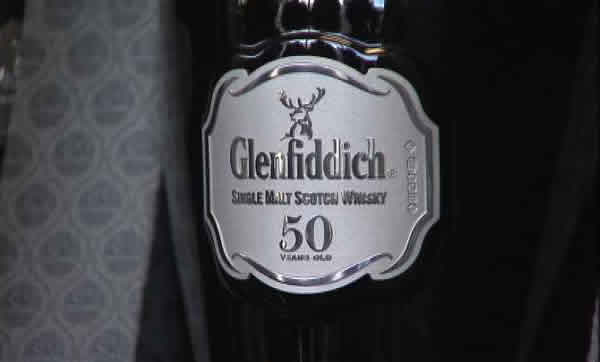 A 50-year-old bottle of Glenfiddich Scotch whisky sells